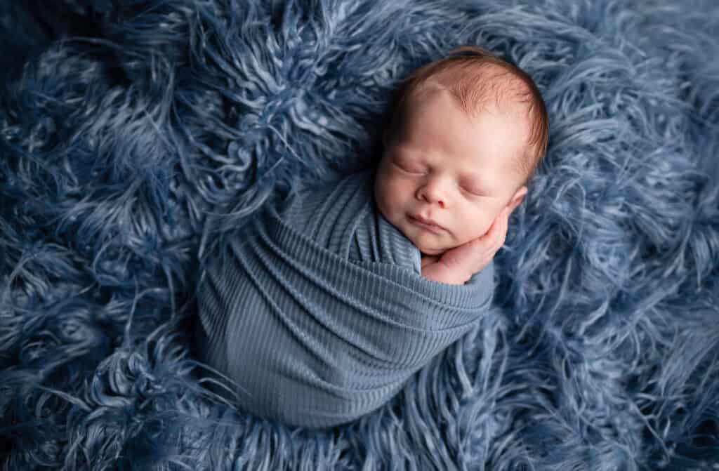 wichita newborn photographer sj nuzum photography baby wrapped in blue