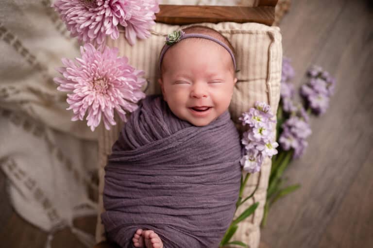 newborn photography wichita ks baby smiles during newborn session