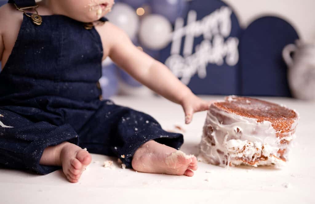 smash cake photographer baby boy flips his cake
