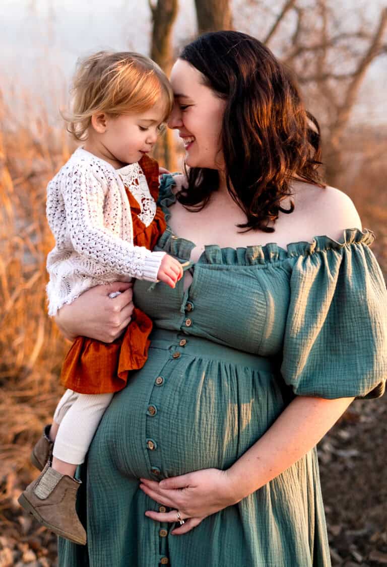 wichita newborn photographer mama and big sister snuggle