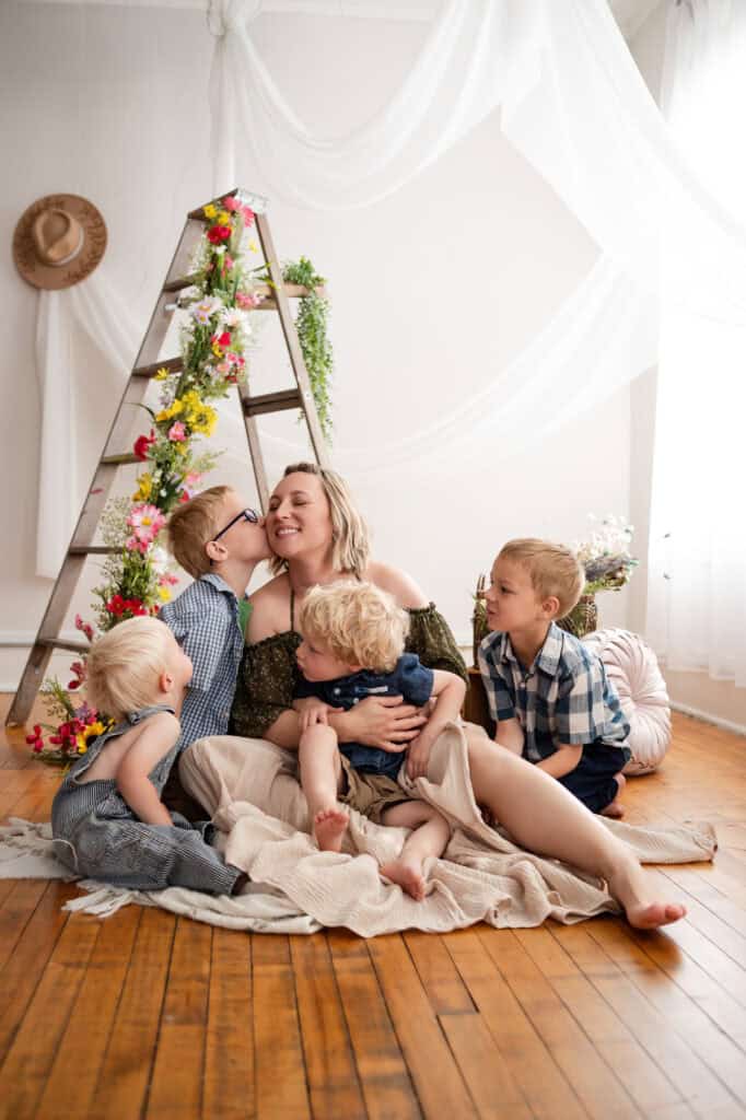 Sara Nuzum's oldest son kisses her in motherhood photos SJ Nuzum Photography