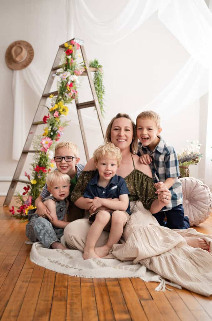 wichita newborn photographer Sara Nuzum SJ Nuzum Photography smiles with her sons