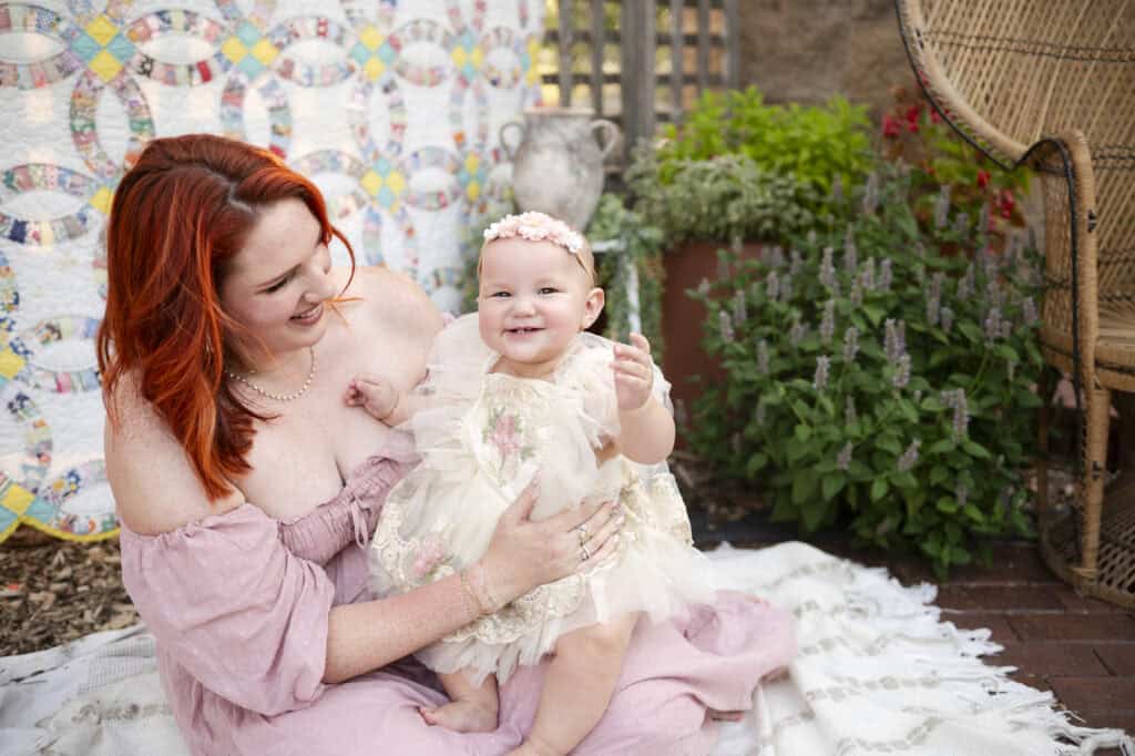 mom and baby girl enjoy a photoshoot for world breastfeeding week sj nuzum photography